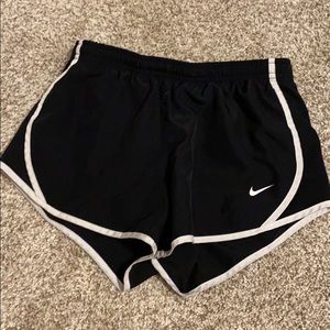 black YOUTH nike shorts with a white rim.